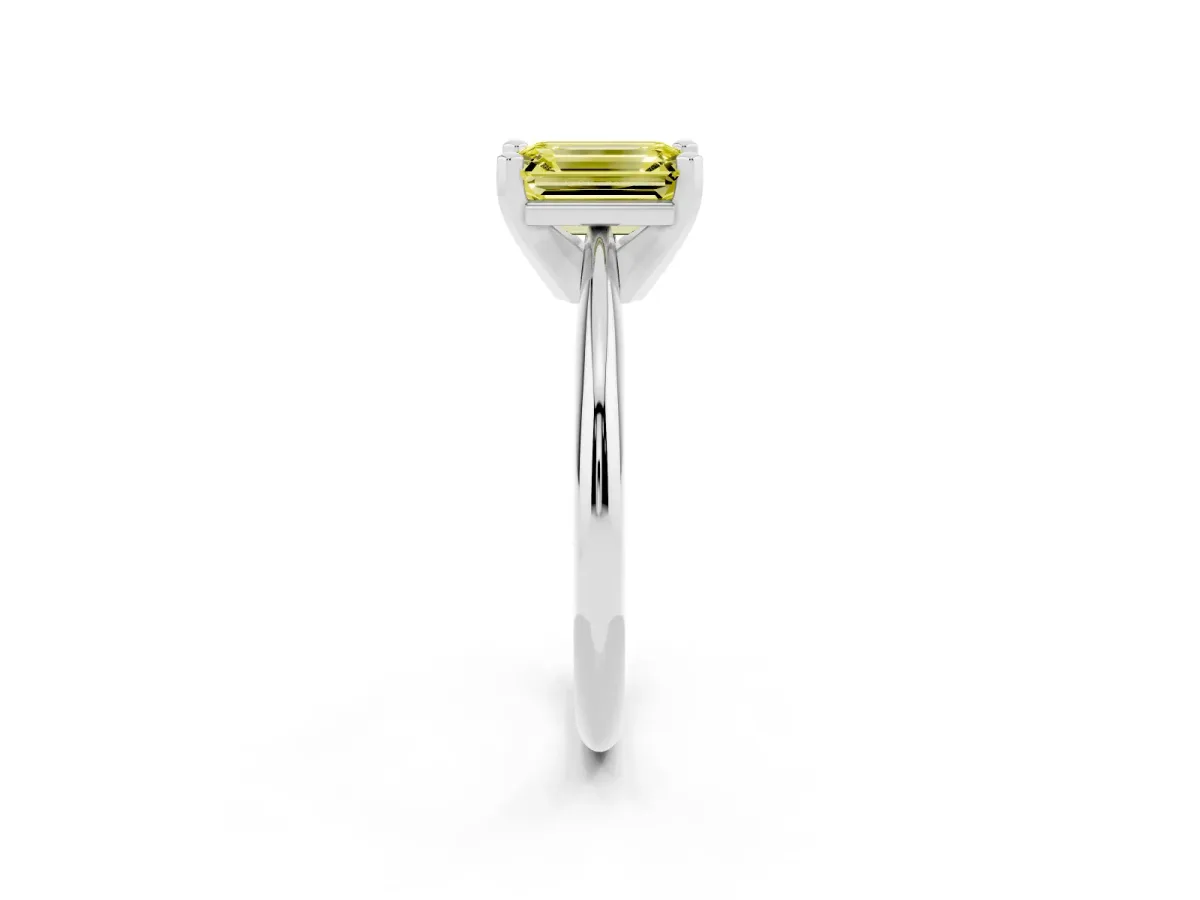 Fancy Yellow Emerald Cut Cut Solitaire Ring with Four-Prong Setting on a Classic Band Silver