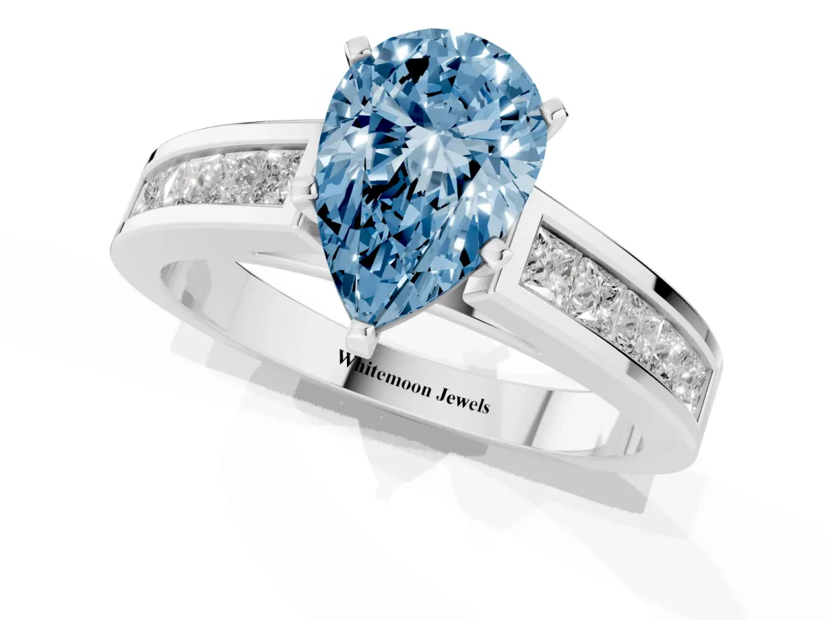Fancy Blue Pear Cut Solitaire Diamond Ring with Channel-Set Band and Four-Prong Setting Silver