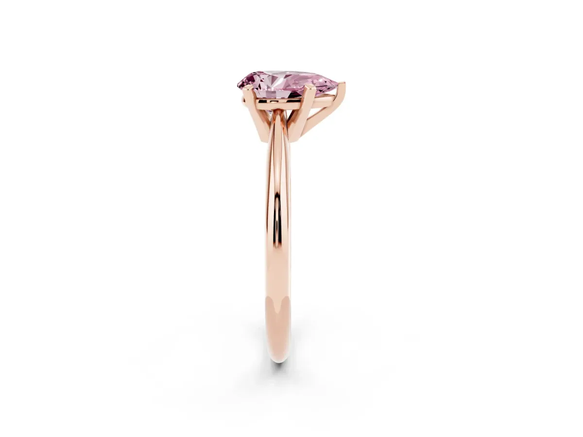 Fancy Pink Pear Cut Cut Solitaire Ring with Four-Prong Setting on a Classic Band Rose gold