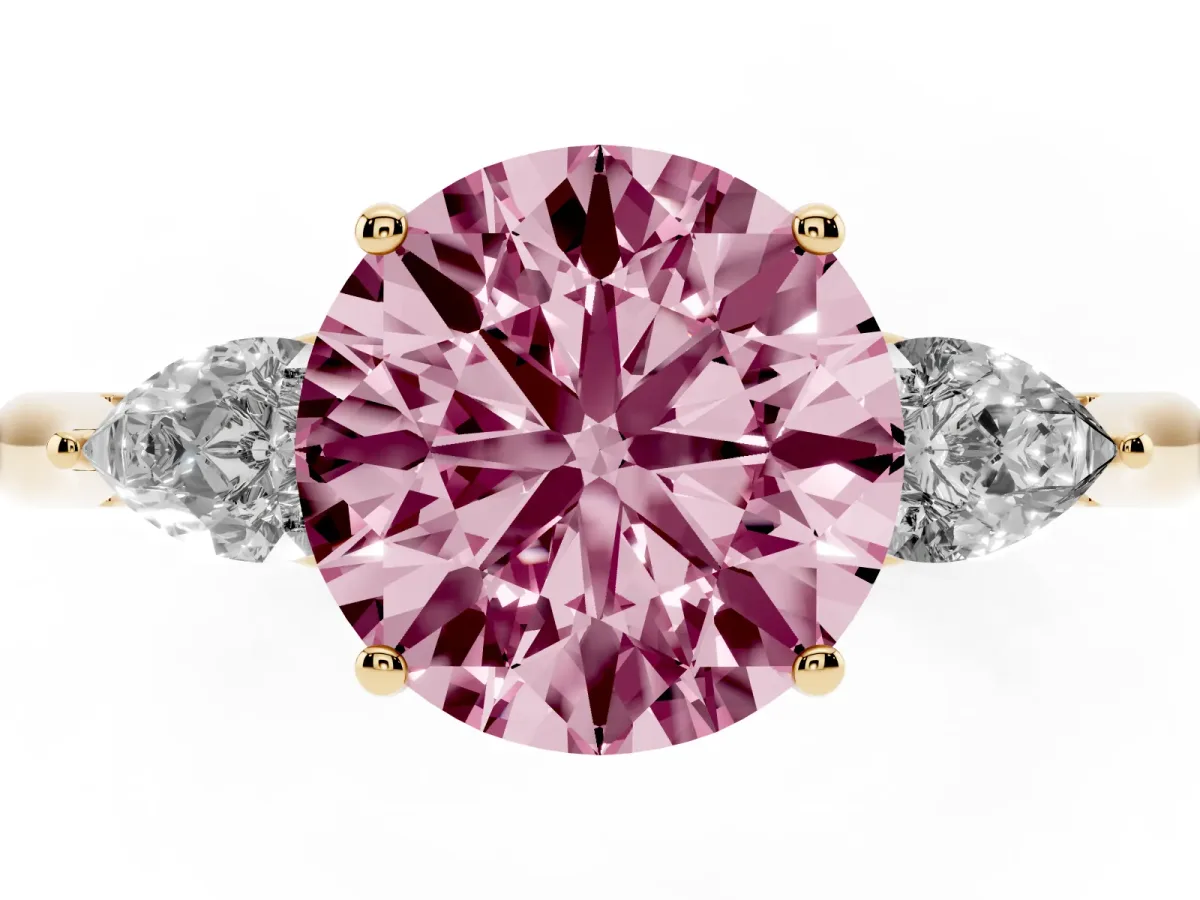 Fancy Pink Three-Stone Round Cut Brilliant Diamond Solitaire Ring with Tapered Band and Four-Prong Setting Yellow gold