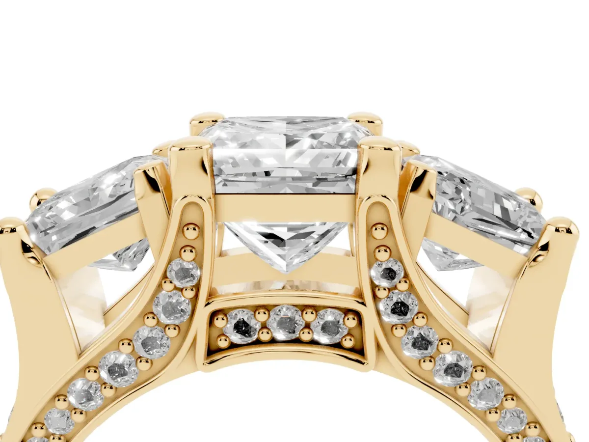 Princess Cut Diamond Three-Stone Ring with Channel Set Band and Four-Prong Setting Yellow gold