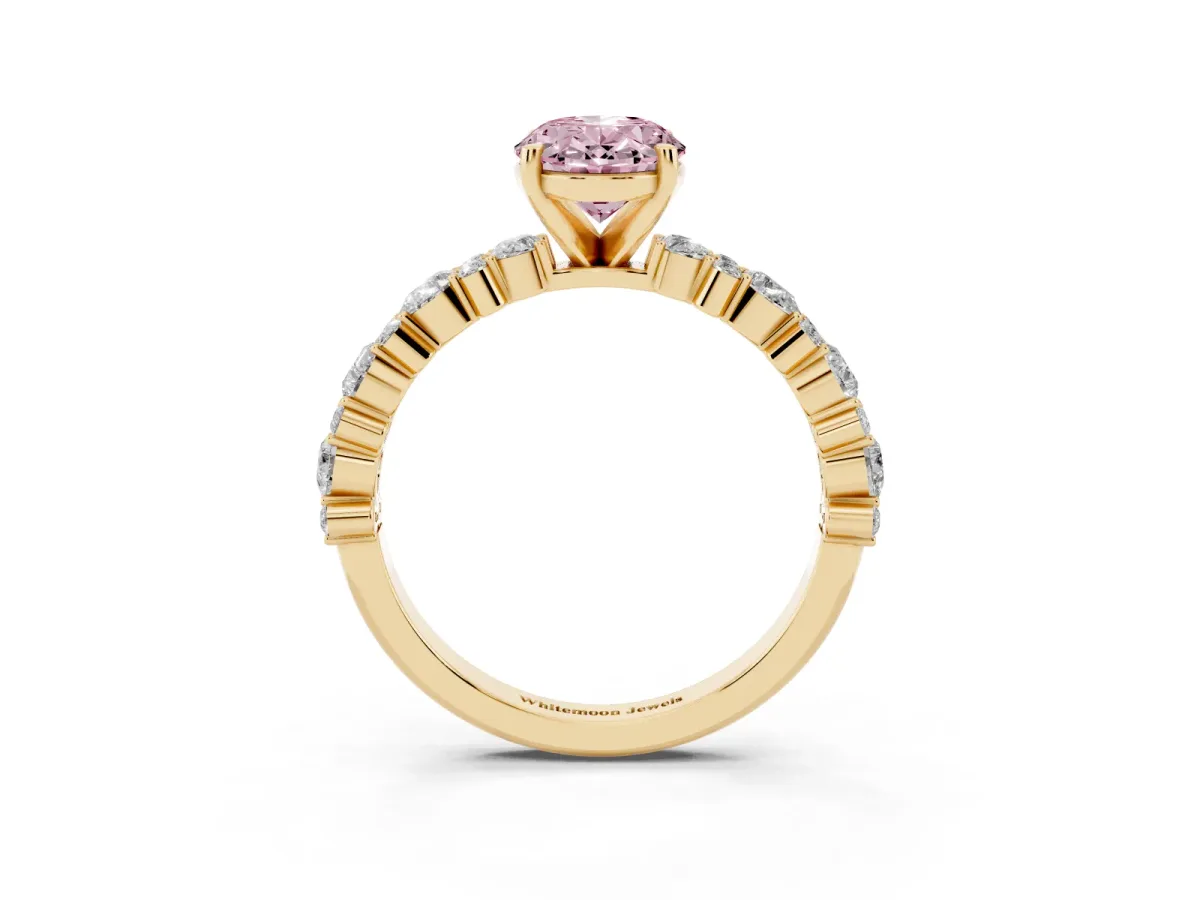Fancy Pink Oval Cut Diamond Side Stone Solitaire Ring with Round and Four-Prong Setting Yellow gold