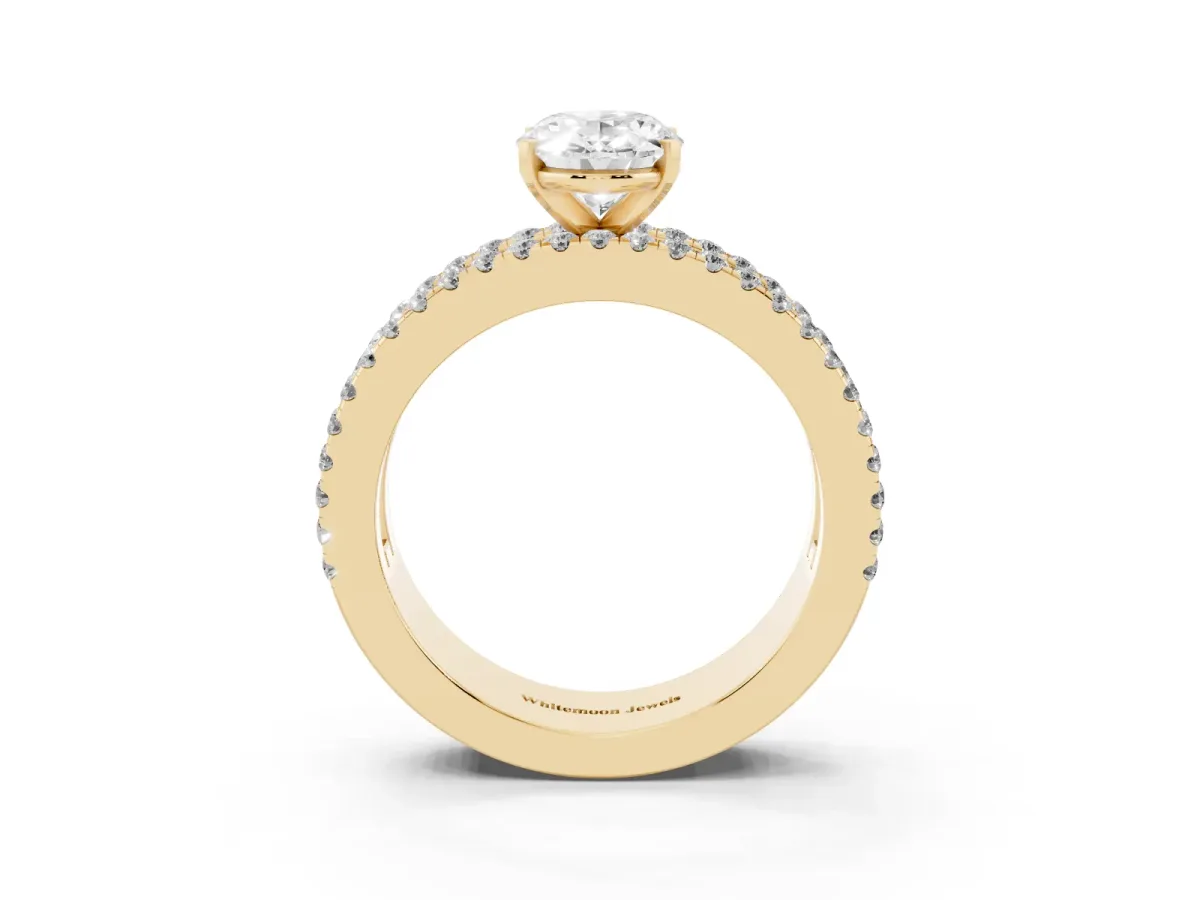 Oval Cut Diamond Solitaire Ring with Pavé and Channel Set Band Yellow gold