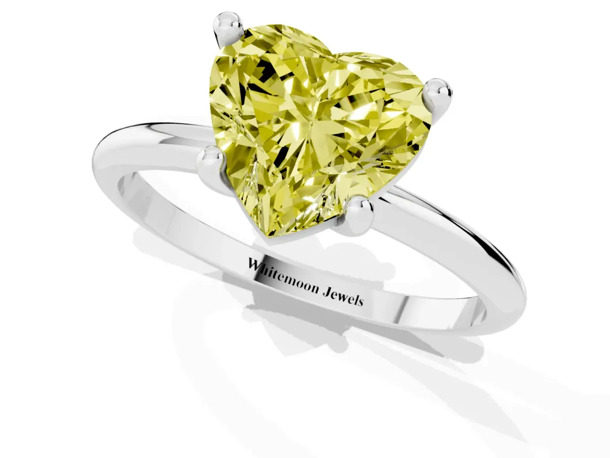 Fancy Yellow Heart Cut Solitaire Diamond Ring with 4-Prong Setting on a Classic Band Silver