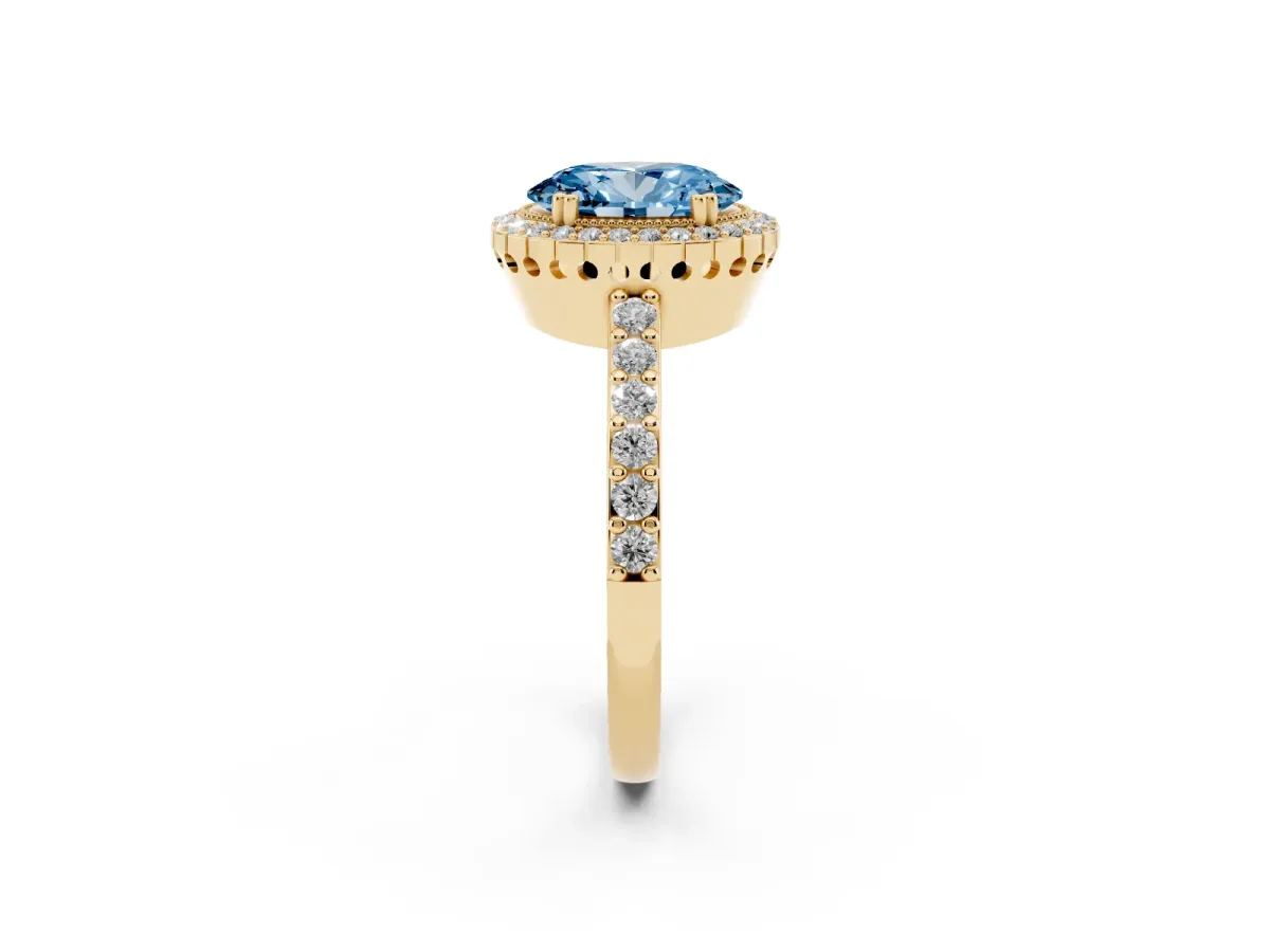 Fancy Blue Oval Cut Cut Diamond Halo Engagement Ring with Milgrain Detail and Pavé Band Yellow gold