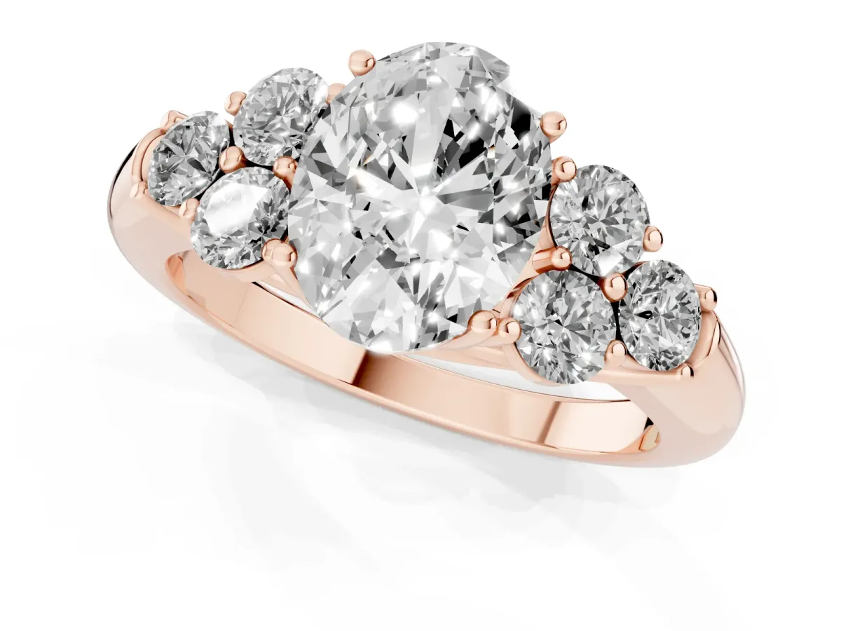 Oval Cut Cut Diamond Cluster Ring with Round Accent Stones and Prong Setting on a Classic Band Rose gold