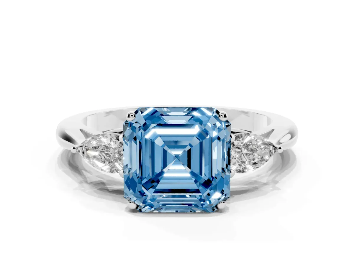Fancy Blue Three-Stone Asscher Cut Diamond Ring with Pear Side Stones in Four-Prong Setting Silver