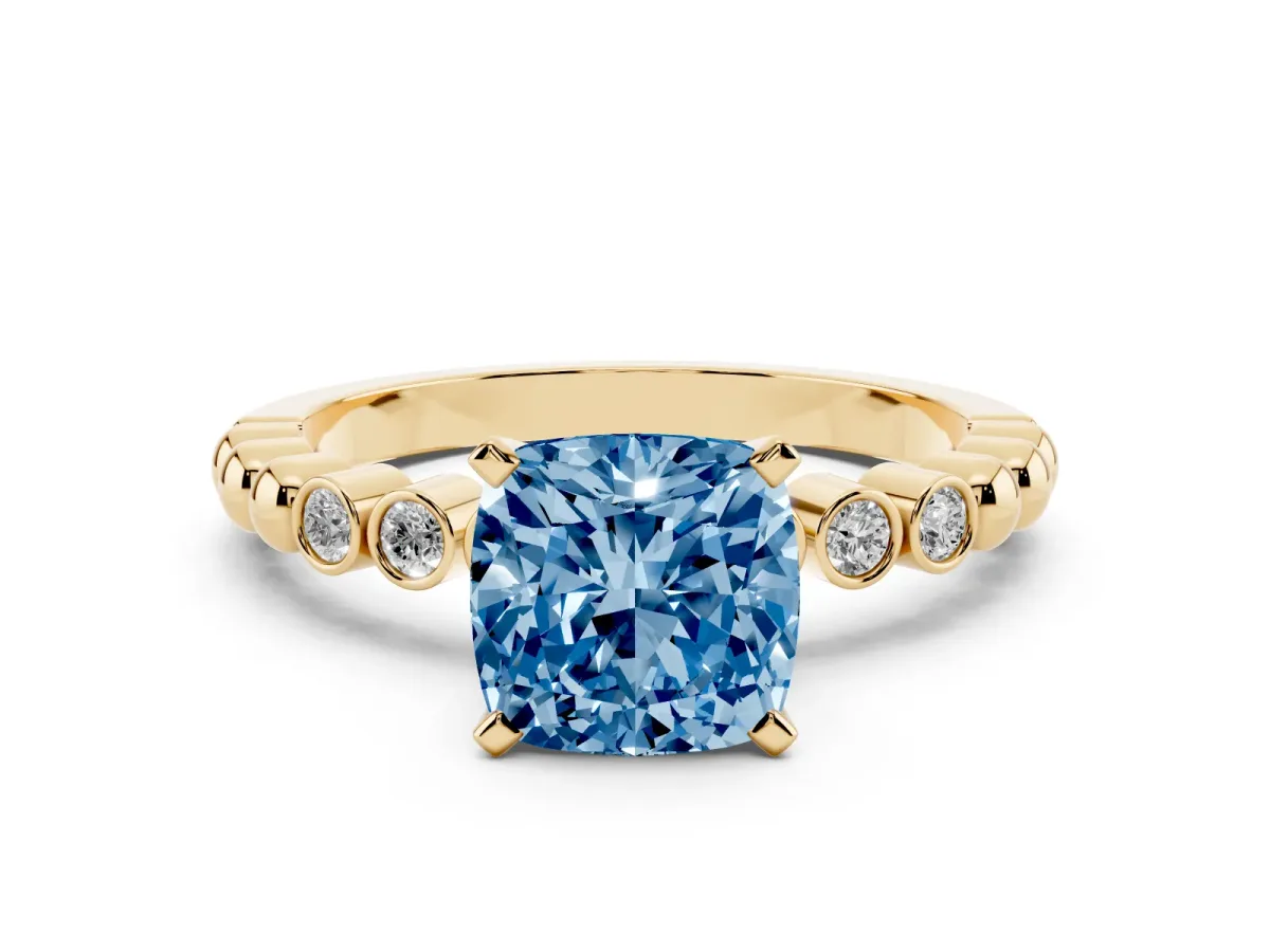Fancy Blue Cushion Cut Solitaire Bezel Accent Diamond Engagement Ring with Beaded Band and Four-Prong Setting Yellow gold