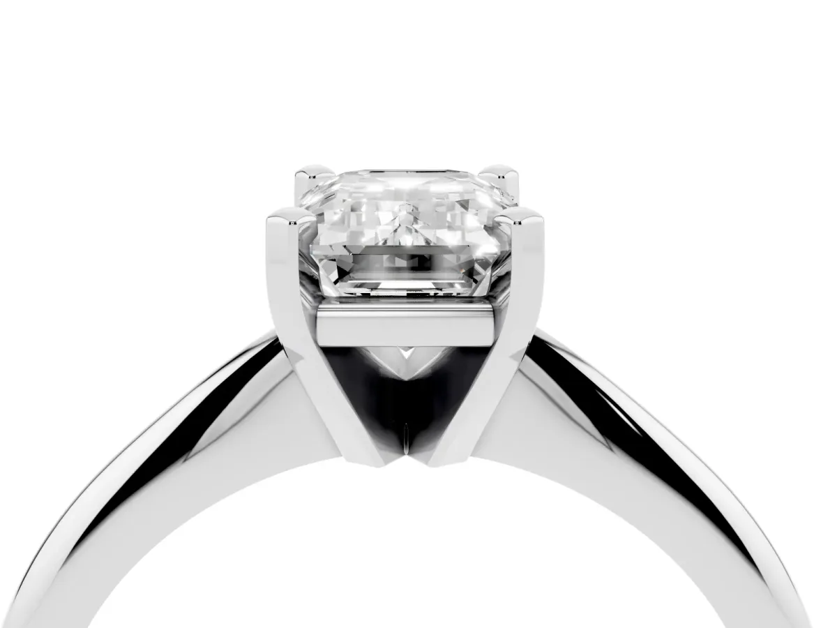 Emerald Cut Cut Solitaire Ring with Four-Prong Setting on a Classic Band Silver