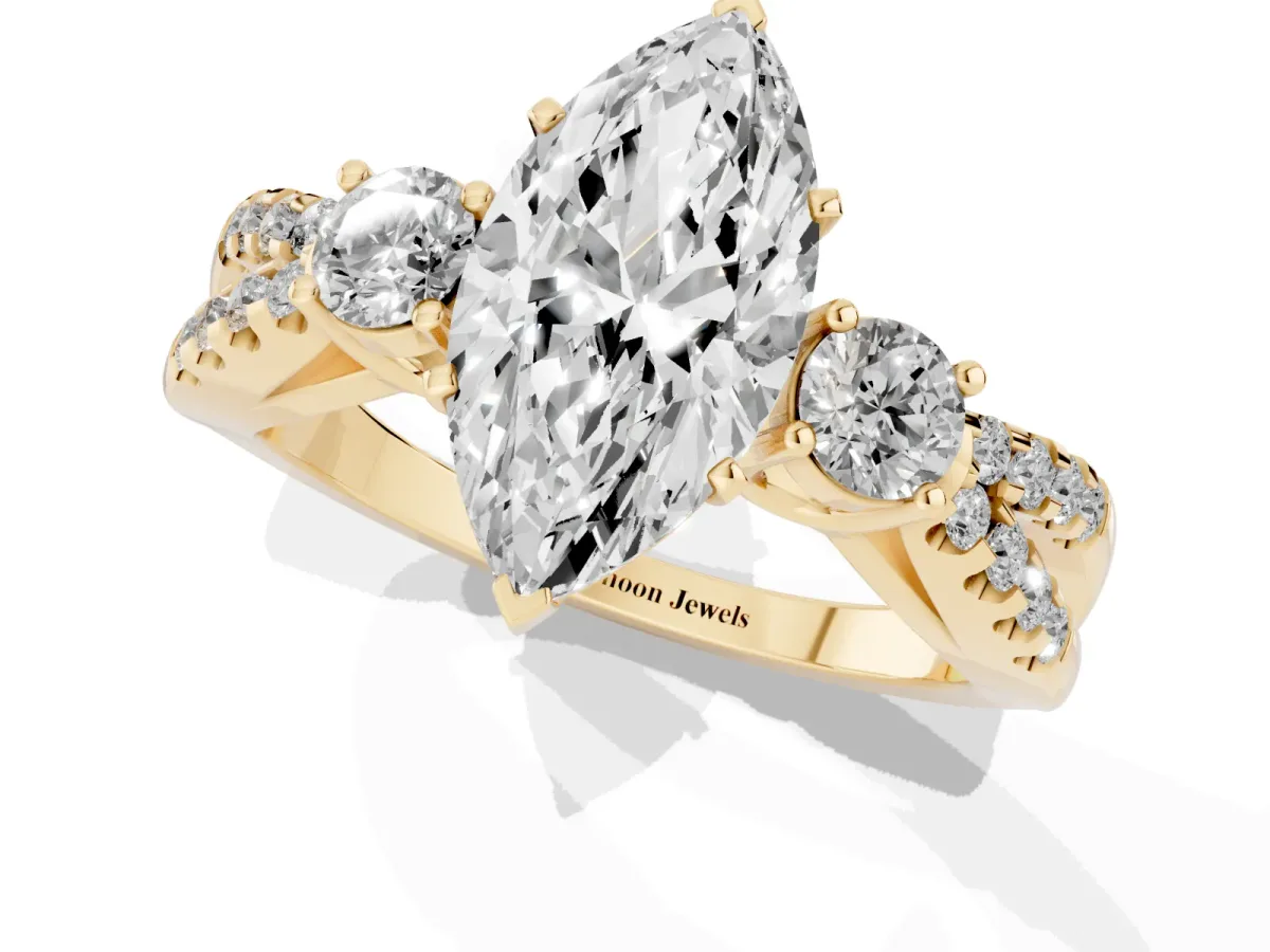 Marquise Cut Diamond Three-Stone Ring with Pavé Split Shank and Four-Prong Setting Yellow gold