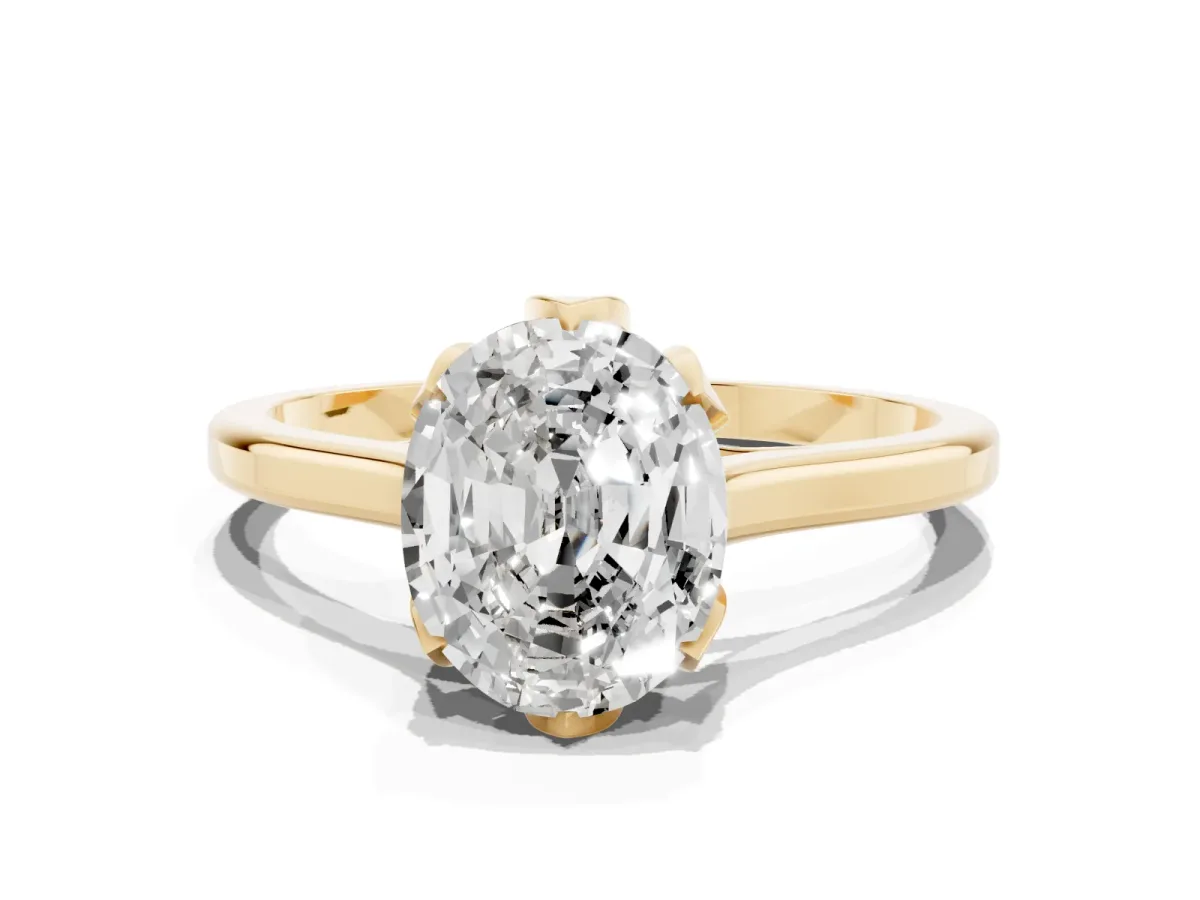 Oval Cut Diamond Solitaire Ring with Flower Prong Setting and Classic Band Yellow gold