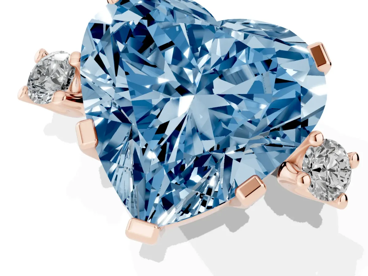 Fancy Blue Heart Cut Cut Three-Stone Solitaire Ring with Round Accent Diamonds and Four-Prong Setting Rose gold