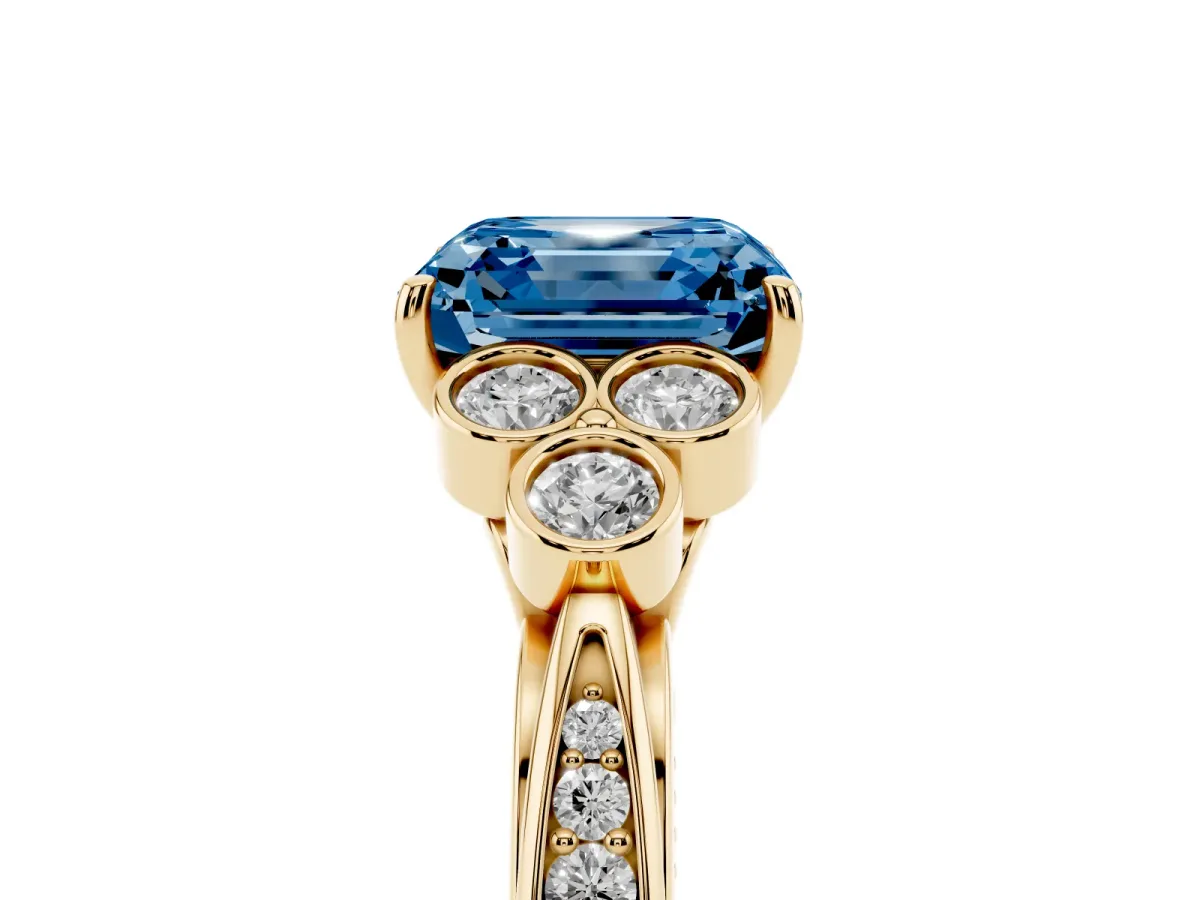 Fancy Blue Asscher Cut Cut Diamond Engagement Ring with Bezel Set Round Side Stones and Prong Setting Yellow gold