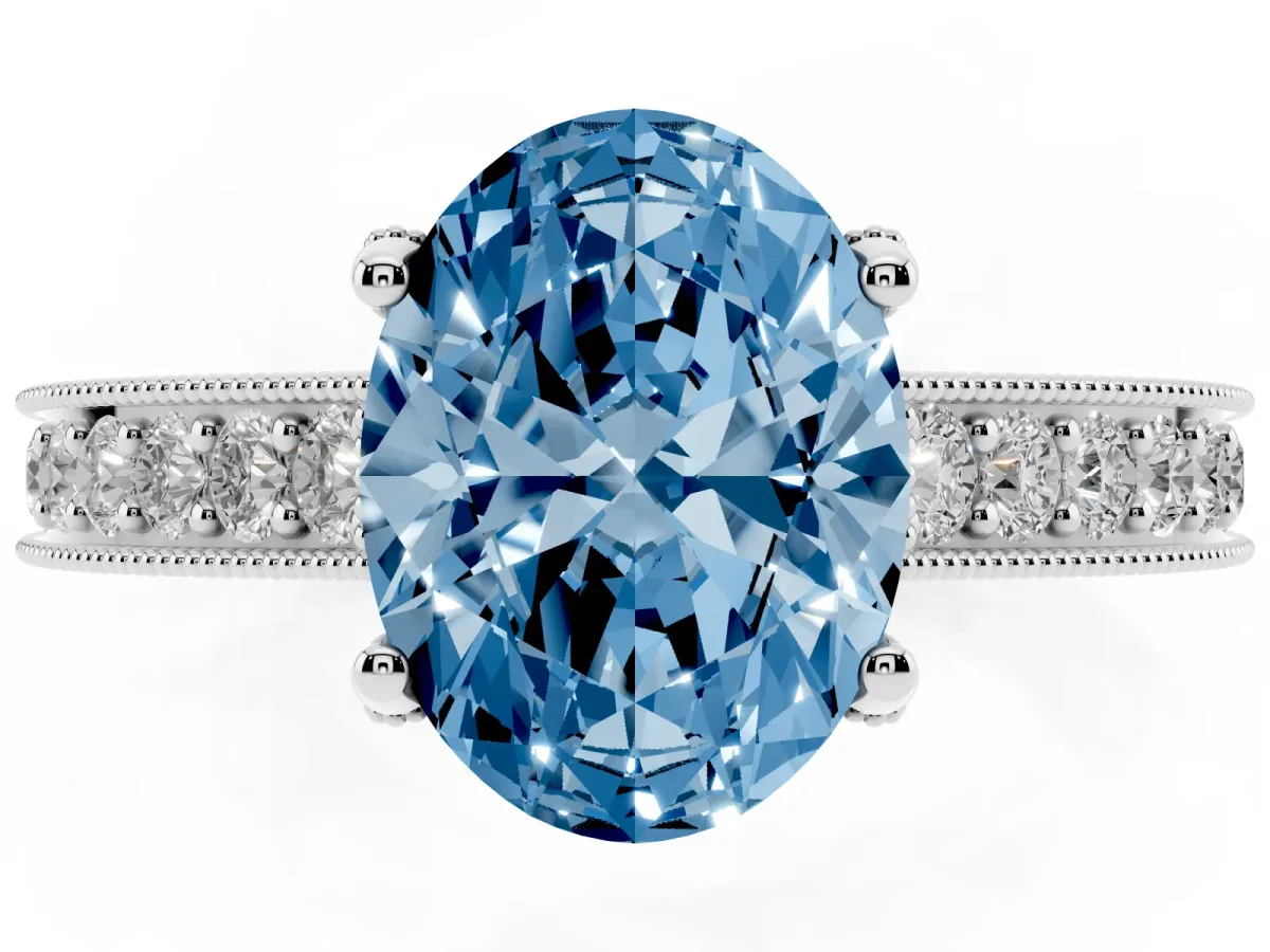 Fancy Blue Oval Cut Cut Diamond Solitaire Ring with Milgrain Pave Band and Four Prong Setting Silver