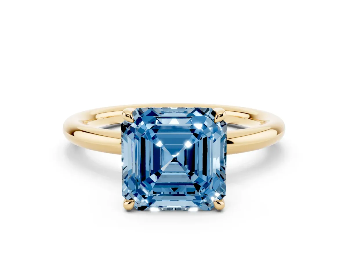 Fancy Blue Asscher Cut Diamond Solitaire Ring with Thin Band and Four-Prong Setting Yellow gold