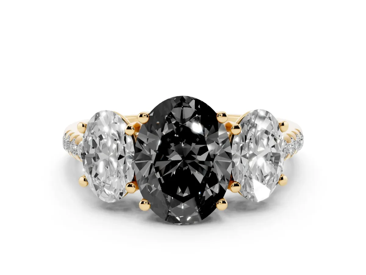 Fancy Black Three-Stone Oval Cut Diamond Ring with Round Pavé Band and Prong Setting Yellow gold