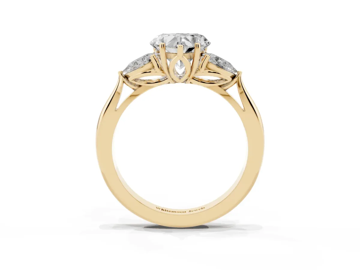 Heart Cut Diamond Three-Stone Ring with Pear Side Stones and Prong Setting Yellow gold