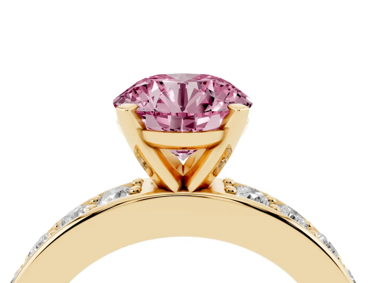 Fancy Pink Round Cut Diamond Engagement Ring with Channel Set Round Band and Prong Setting Yellow gold
