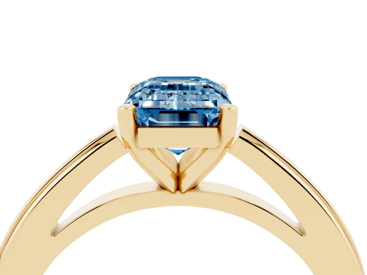 Fancy Blue Emerald Cut Solitaire Diamond Ring with Four-Prong Setting and Classic Band Yellow gold
