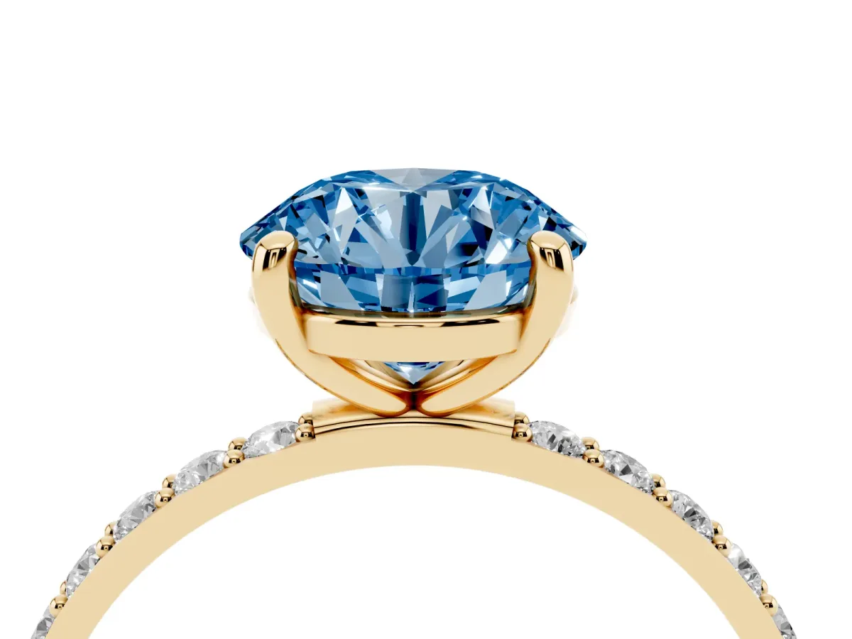 Fancy Blue Round Cut Diamond Solitaire Ring with Round Pavé Band and Prong Setting Yellow gold