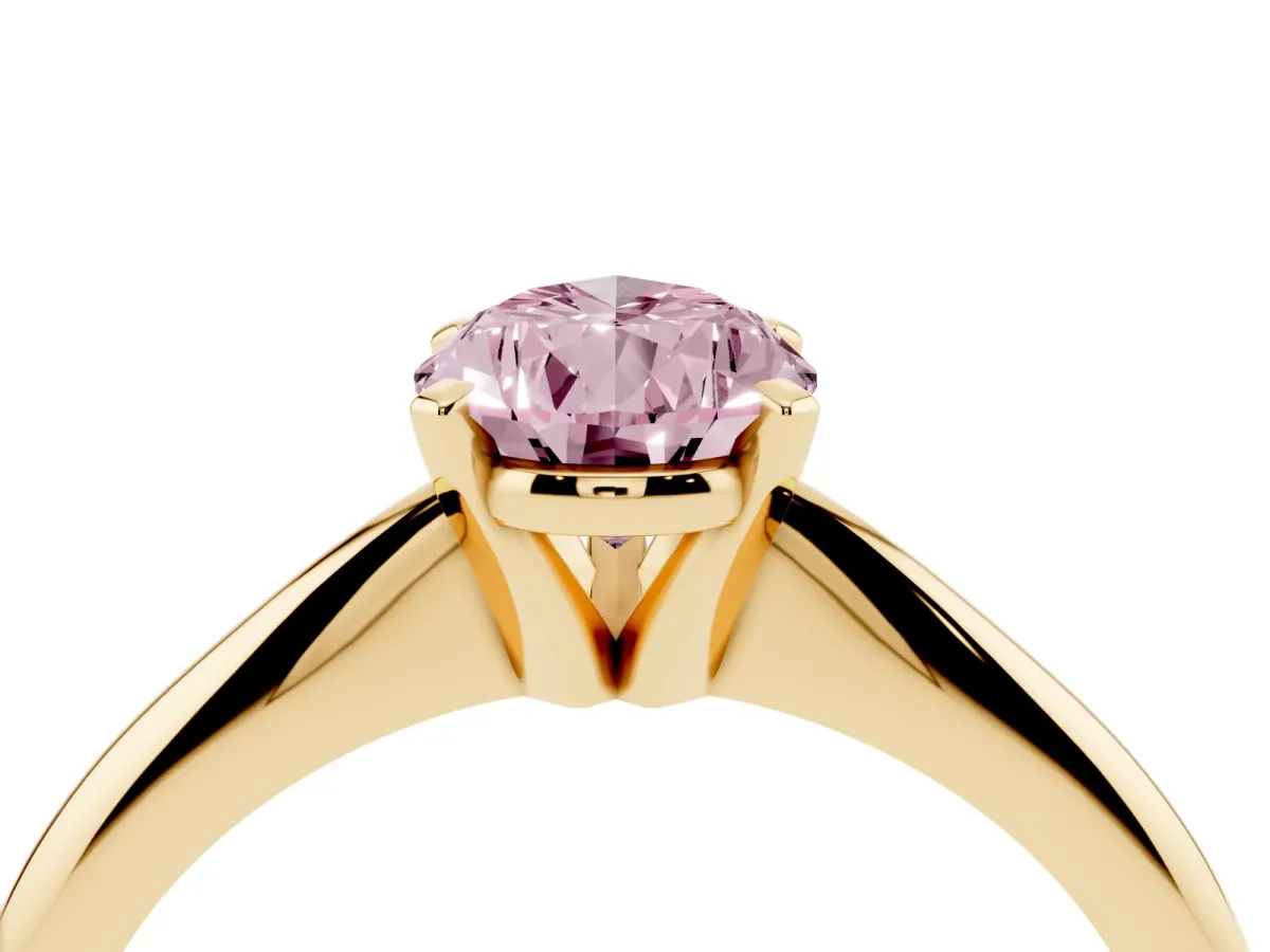 Fancy Pink Pear Cut Cut Solitaire Ring with Four-Prong Setting on a Classic Band Yellow gold