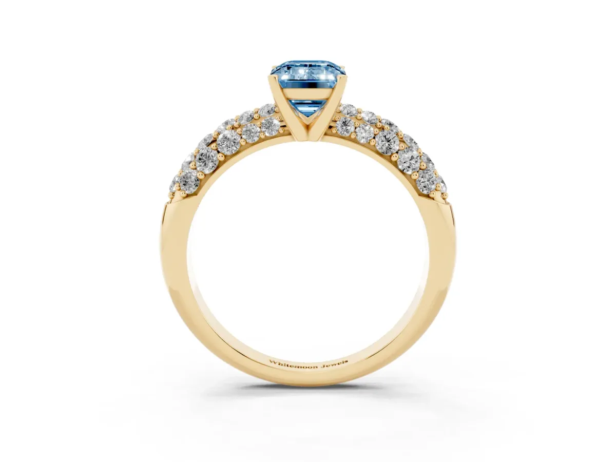 Fancy Blue Emerald Cut Diamond Pavé Band Solitaire Ring with Four-Prong Setting Yellow gold
