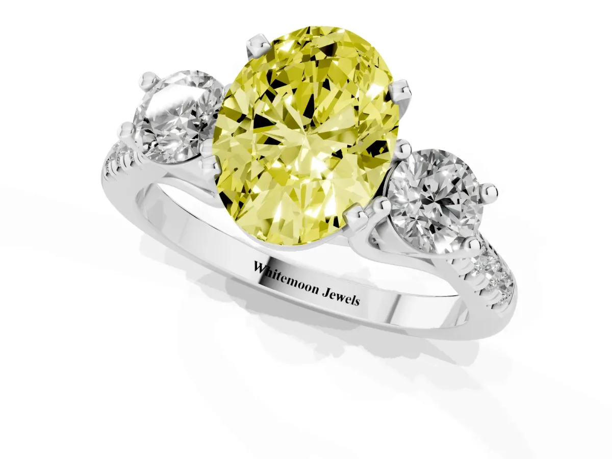 Fancy Yellow Three-Stone Oval Cut Diamond Pavé Band with Four-Prong Setting Platinum