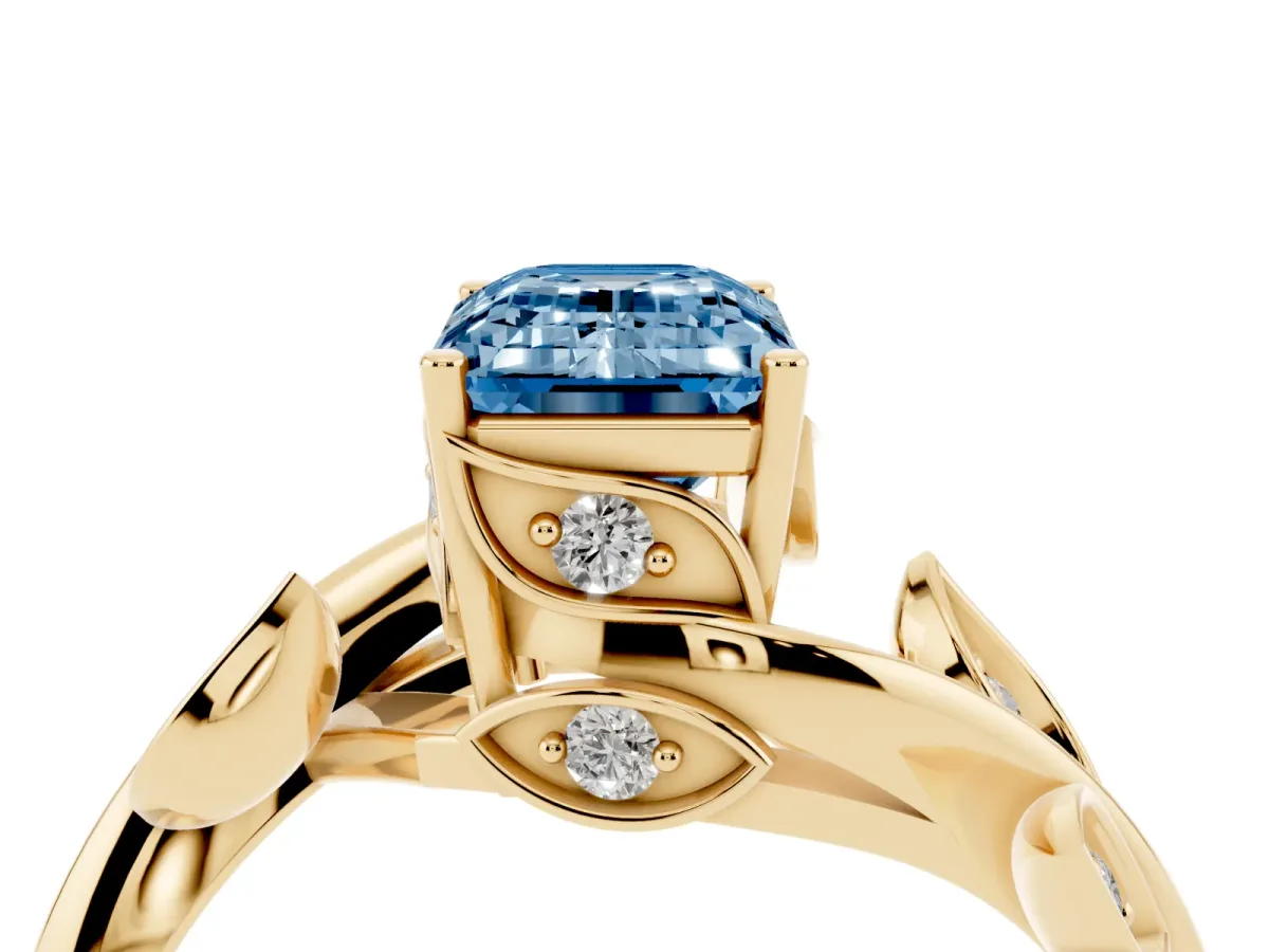 Fancy Blue Emerald Cut Solitaire Twist Engagement Ring with Leaf Accents and Prong Setting Yellow gold