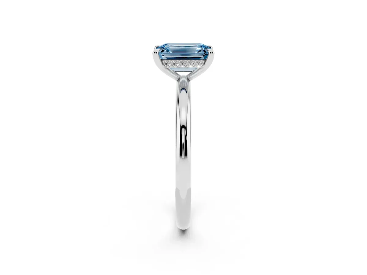 Fancy Blue Emerald Cut Diamond Solitaire Ring with Thin Band and Four-Prong Setting Silver