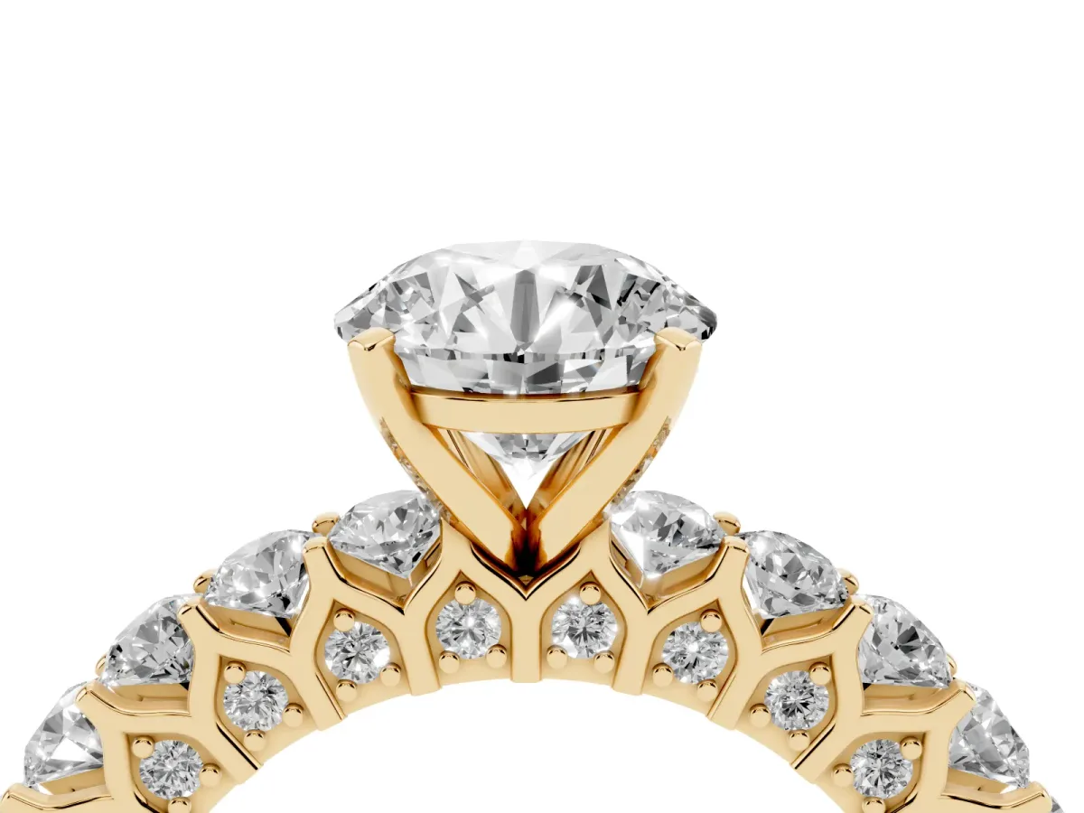 Round Cut Diamond Solitaire Ring with Shared Prong Pavé Band and Four-Prong Setting Yellow gold