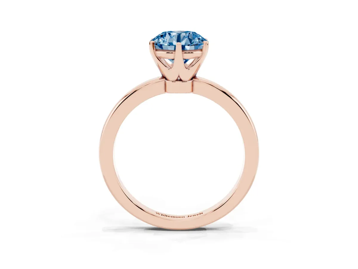 Fancy Blue Round Cut Solitaire Diamond Ring with Six-Prong Setting on a Classic Band Rose gold