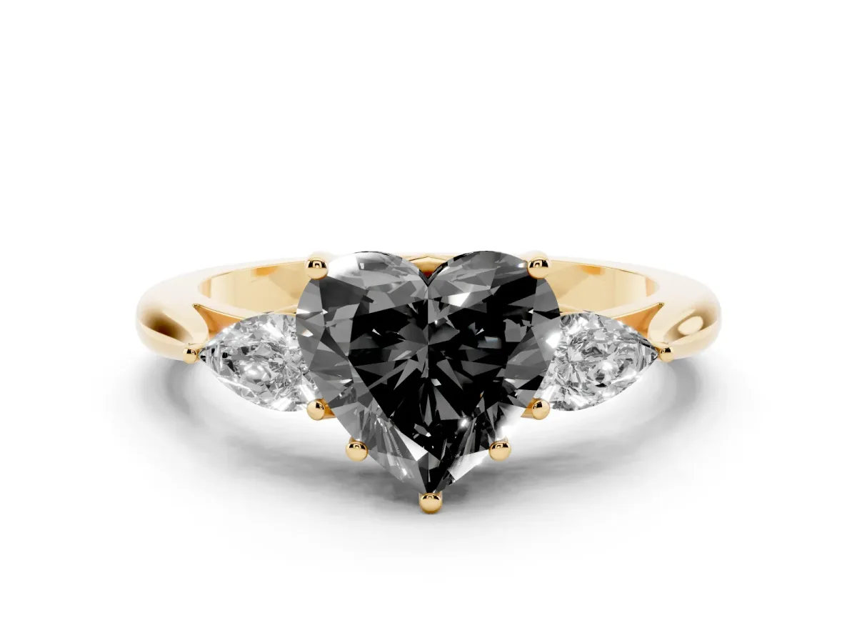 Fancy Black Three-Stone Heart Cut Brilliant Diamond Solitaire Ring with Tapered Band and Four-Prong Setting Yellow gold