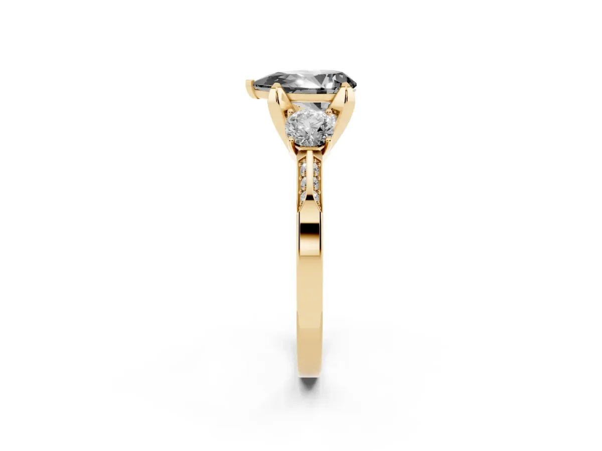 Fancy Black Pear Cut Brilliant Three-Stone Diamond Ring with Pavé Band and Four-Prong Setting Yellow gold