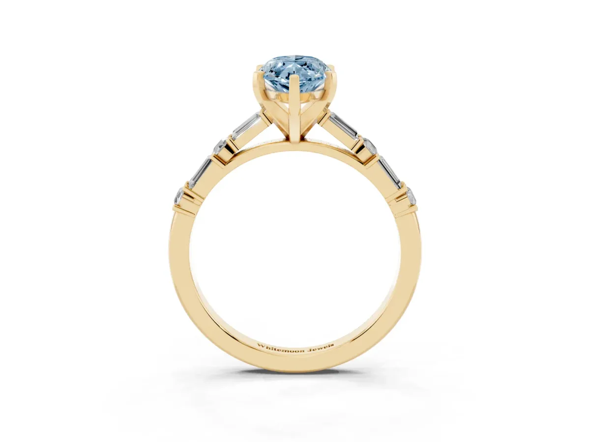 Fancy Blue Marquise Cut Diamond Solitaire with Side Baguettes and Channel Set Band Yellow gold