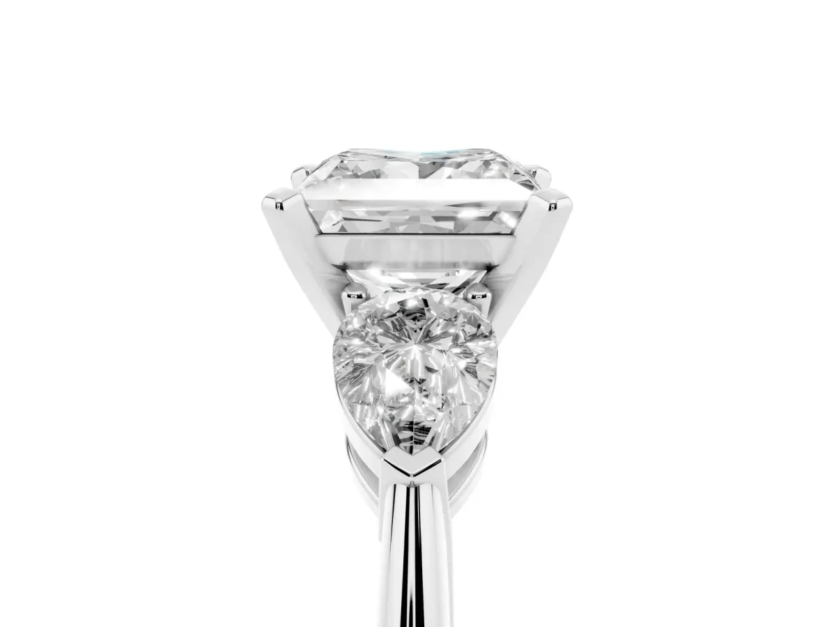 Three-Stone Princess Cut Diamond Ring with Pear Side Stones and Four-Prong Setting Platinum