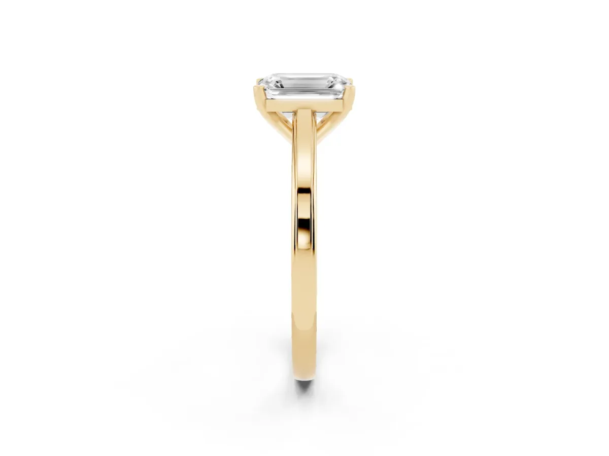 Emerald Cut Solitaire Diamond Ring with Four-Prong Setting and Classic Band Yellow gold