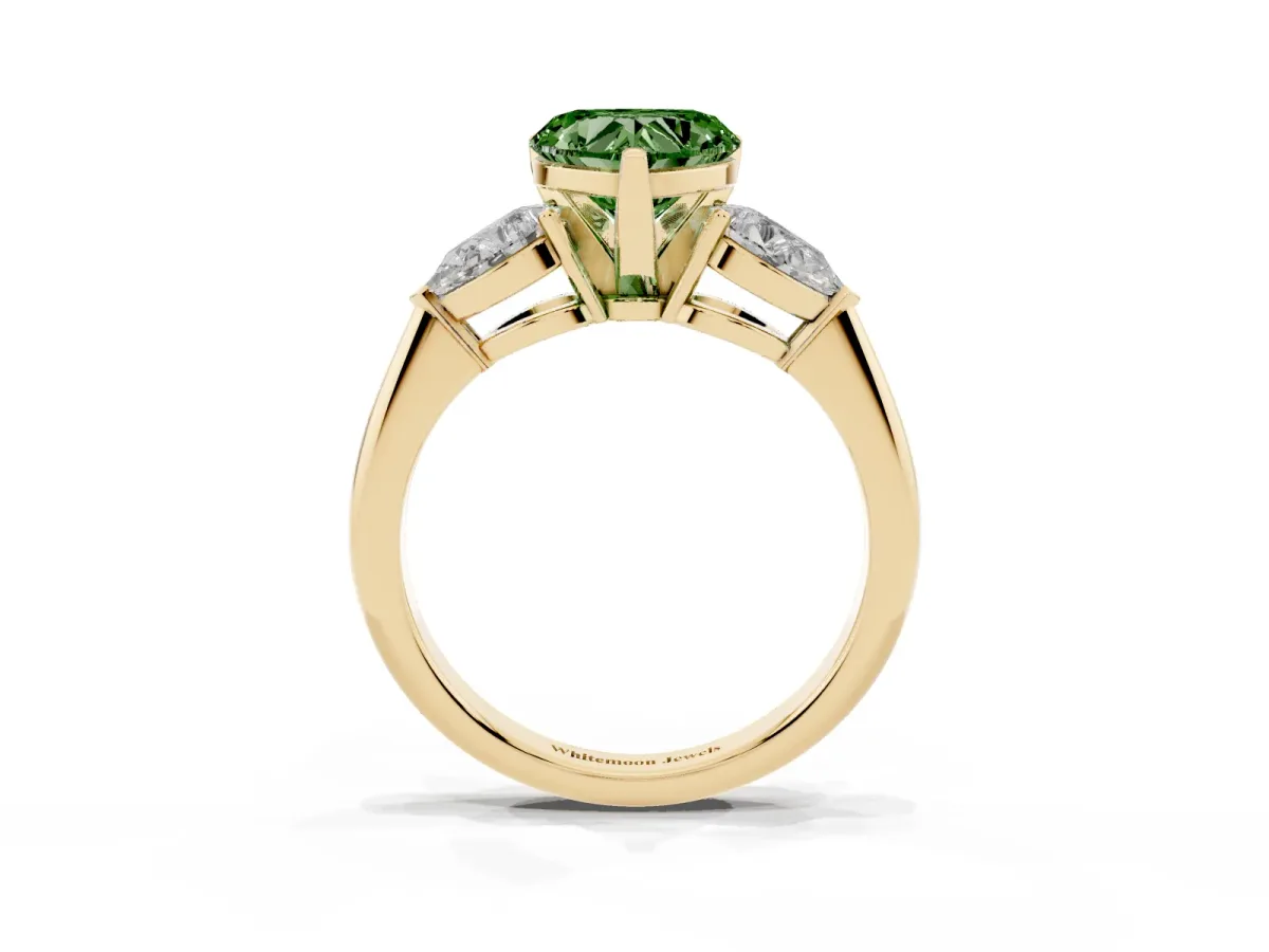 Fancy Green Three-Stone Heart Cut Diamond Ring with Pear Side Stones and Four-Prong Setting Yellow gold
