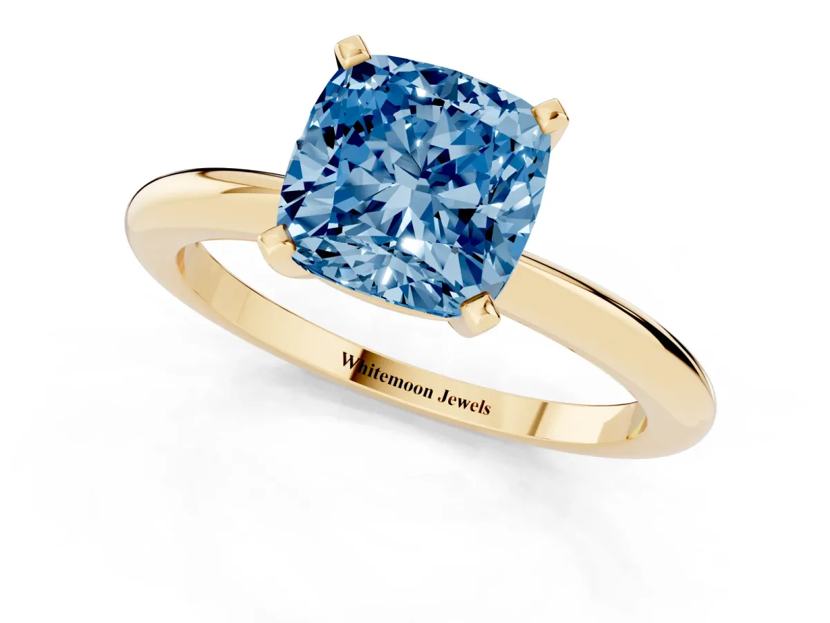 Fancy Blue Cushion Cut Diamond Solitaire Ring with Prong Setting and Classic Band Yellow gold