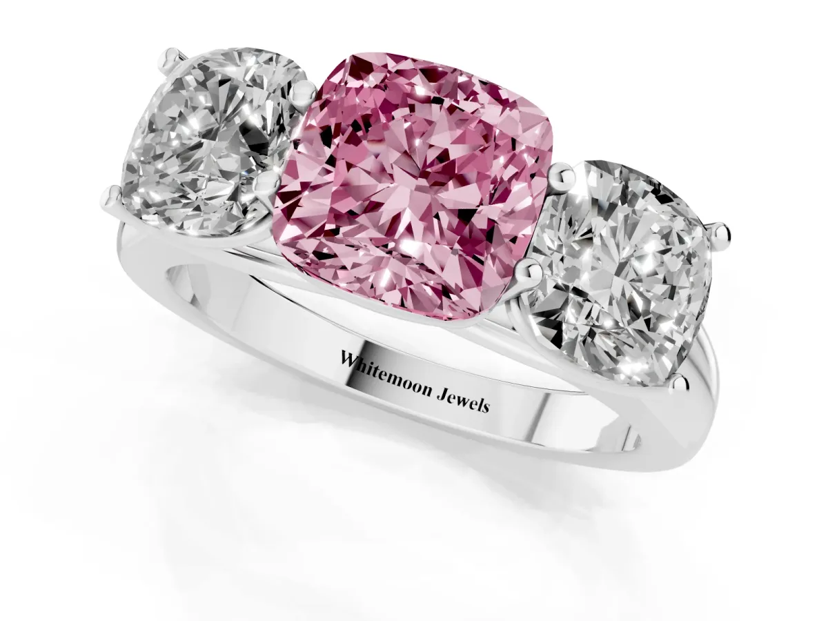 Fancy Pink Cushion Cut Three-Stone Diamond Ring with Prong Setting on a Classic Band Platinum