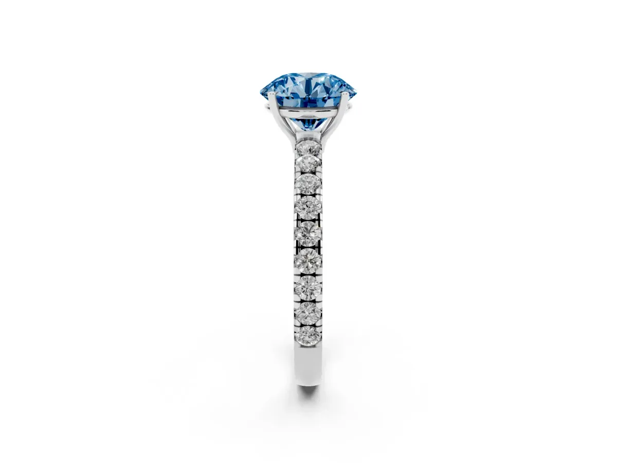 Fancy Blue Round Cut Diamond Pavé Solitaire Engagement Ring with Four-Prong Setting Silver