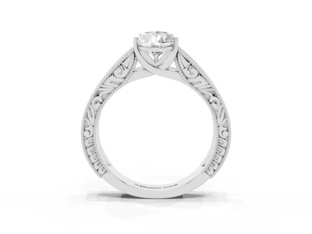 Pear Cut Diamond Solitaire Ring with Engraved Band and Four-Prong Setting Silver