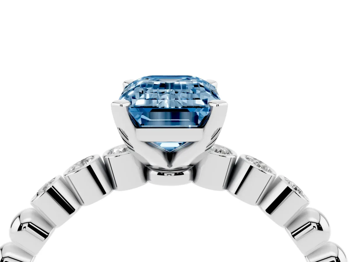 Fancy Blue Emerald Cut Solitaire Bezel Accent Diamond Engagement Ring with Beaded Band and Four-Prong Setting White gold
