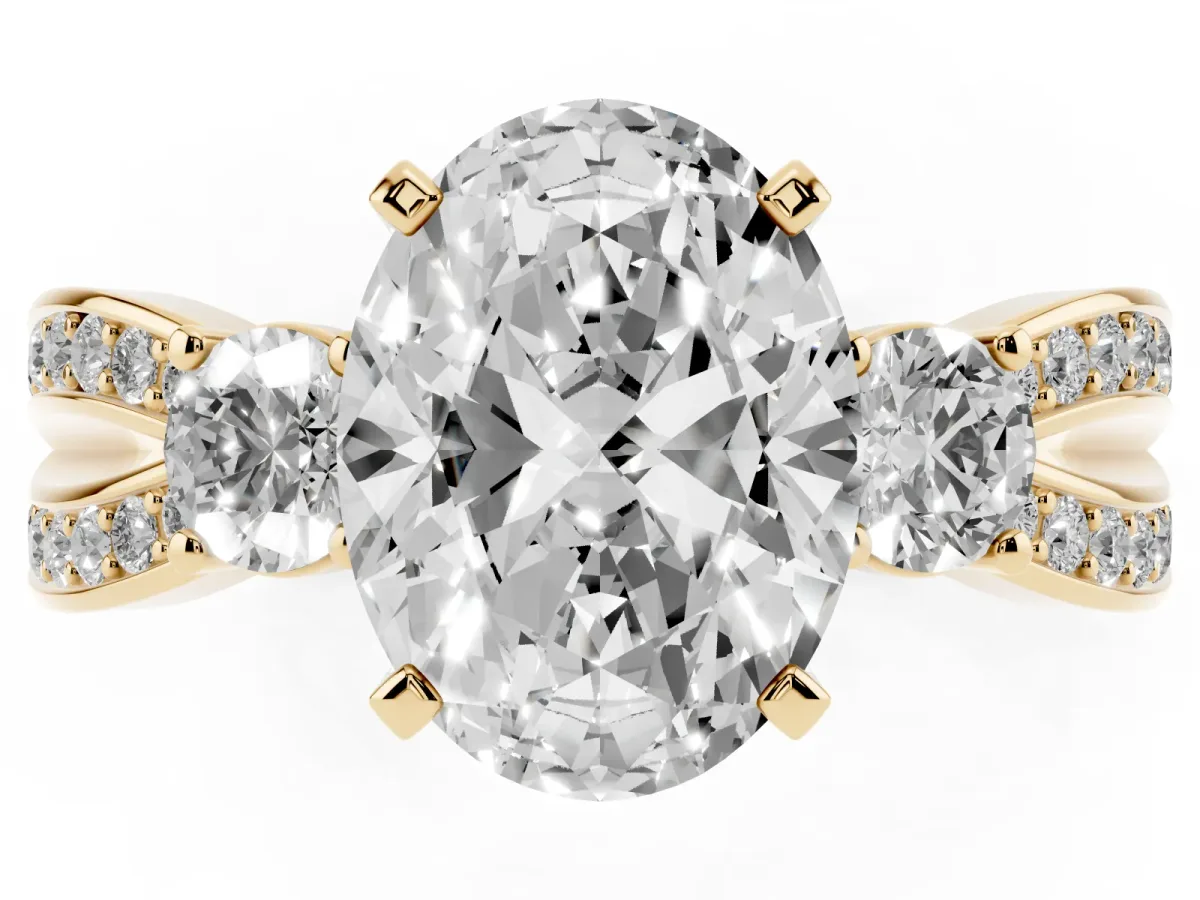 Three-Stone Oval Cut Cut Diamond Twist Band with Prong Setting Yellow gold