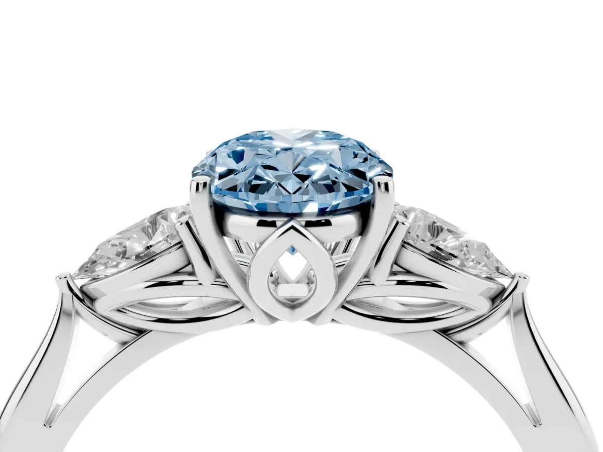 Fancy Blue Three-Stone Oval Cut Brilliant Diamond Solitaire Ring with Tapered Band and Four-Prong Setting Platinum