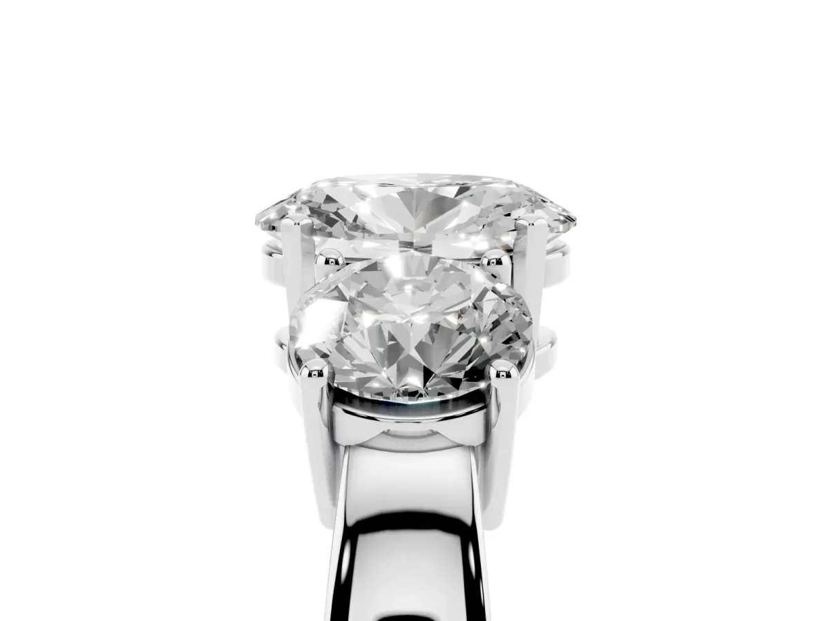 Three-Stone Oval Cut Diamond Ring with Round Side Stones, Classic Band, and Four-Prong Setting Silver