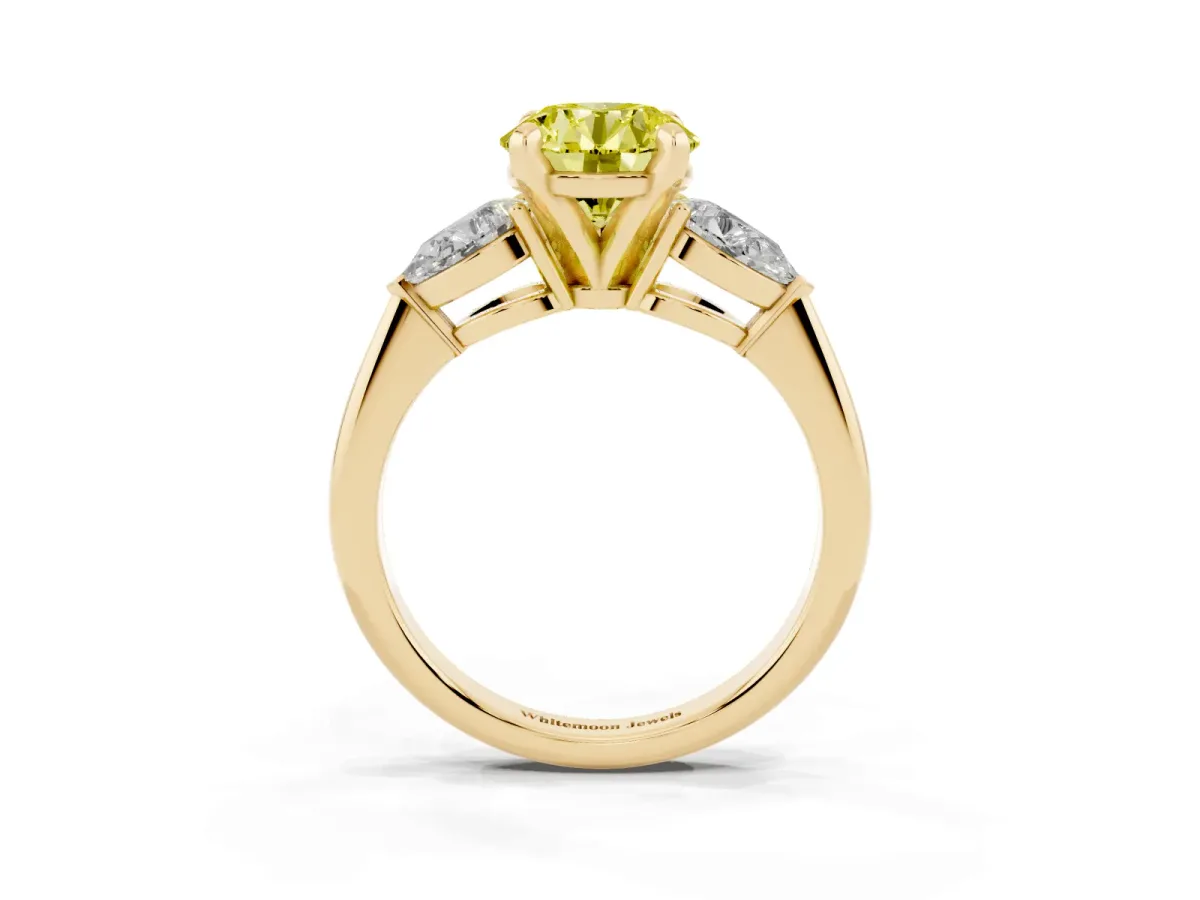 Fancy Yellow Three-Stone Round Cut Diamond Ring with Pear Side Stones and Four-Prong Setting Yellow gold