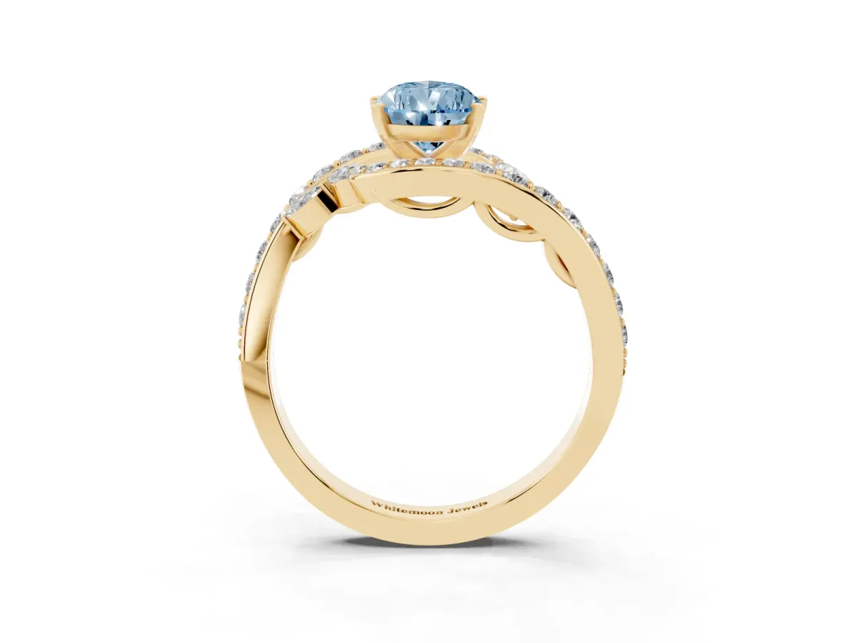 Fancy Blue Pear Cut Solitaire with Pavé Twist Band and Four-Prong Setting Yellow gold
