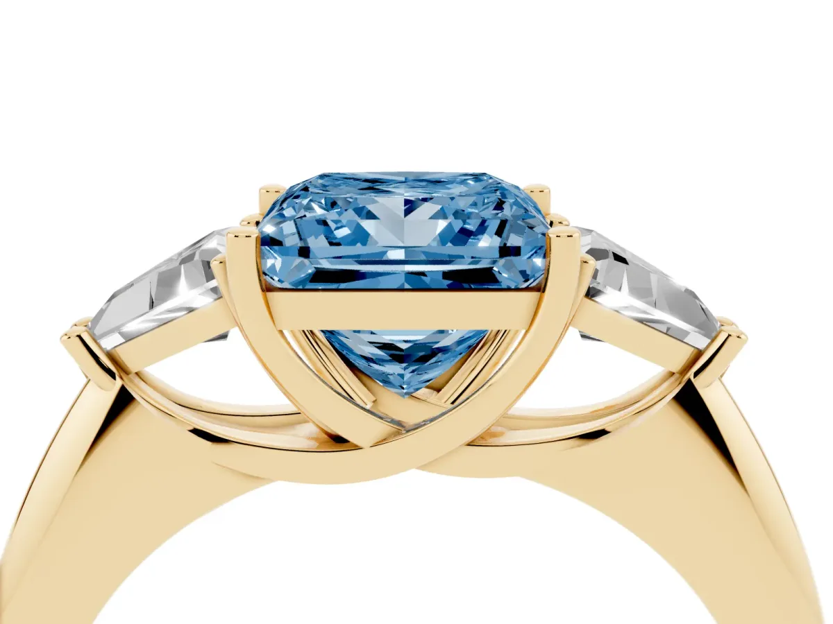 Fancy Blue Three-Stone Princess Cut Diamond Engagement Ring with Trillion Side Stones and Prong Setting Yellow gold