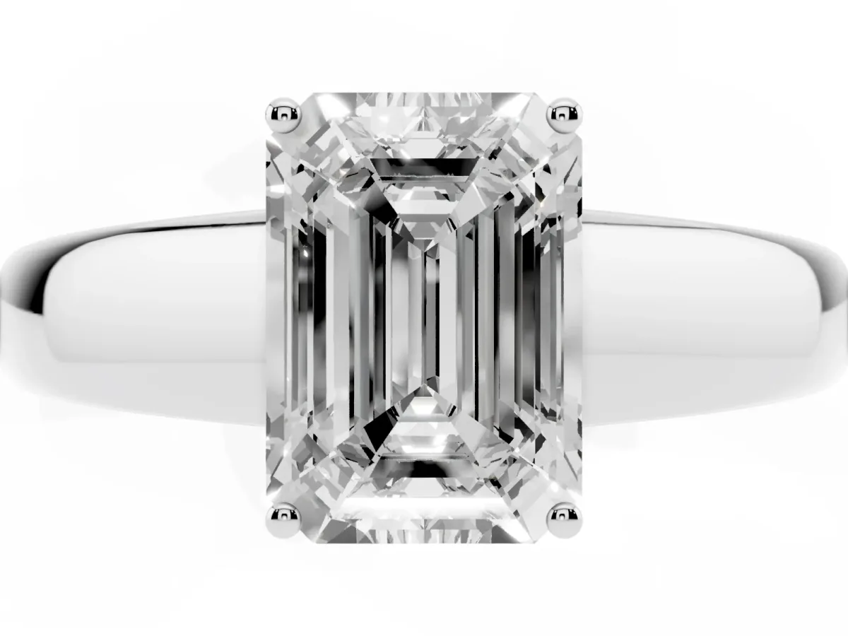 Emerald Cut Solitaire Diamond Ring with Tapered Band and Four-Prong Setting White gold
