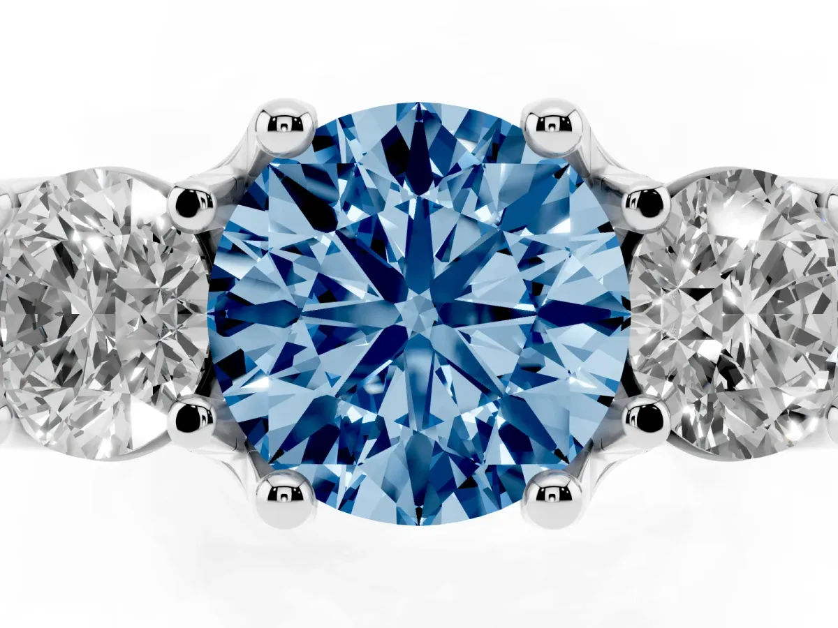 Fancy Blue Round Cut Diamond Three-Stone Ring with Channel Set Band and Four-Prong Setting Silver